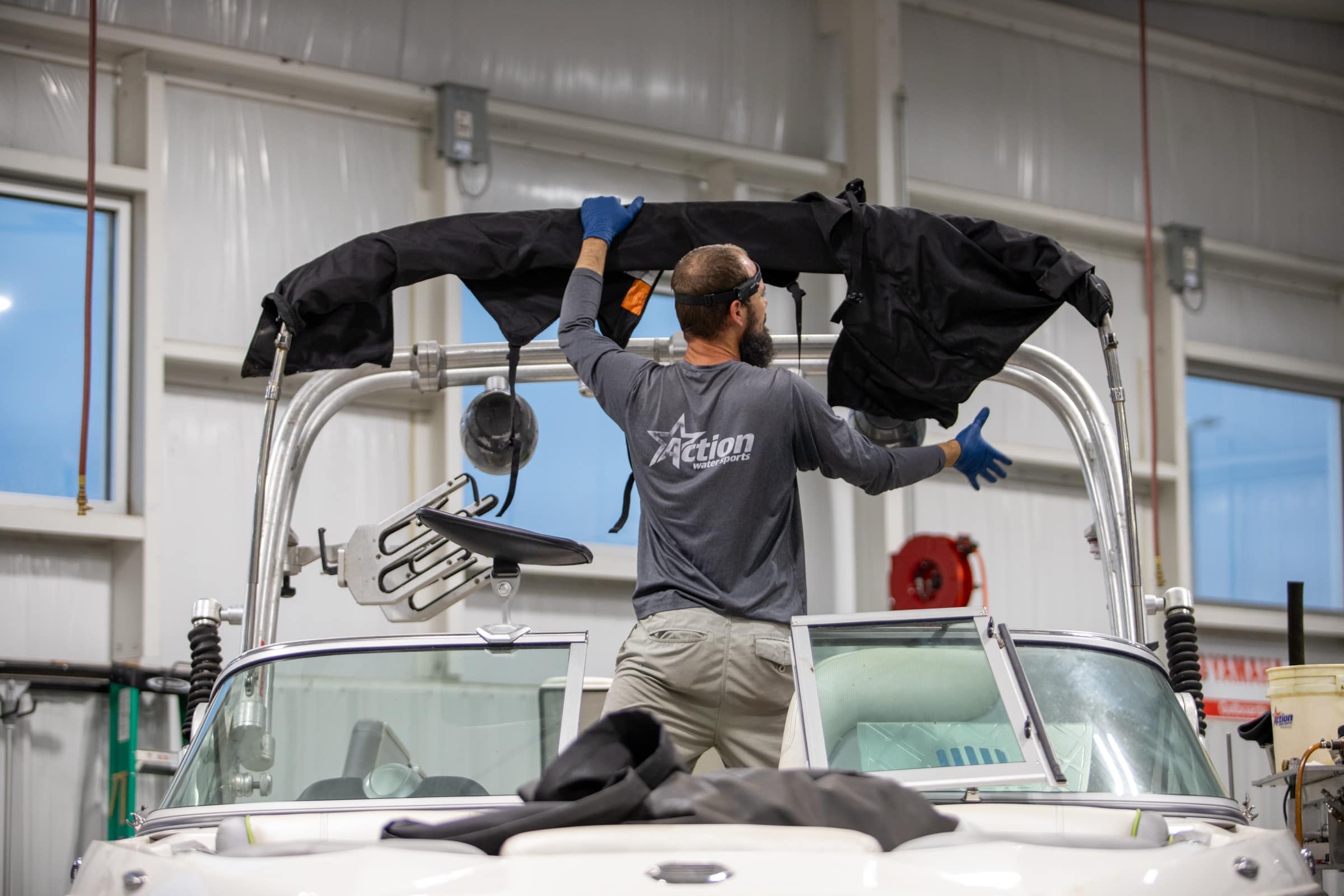 Action Water Sports technician at work in the service shop