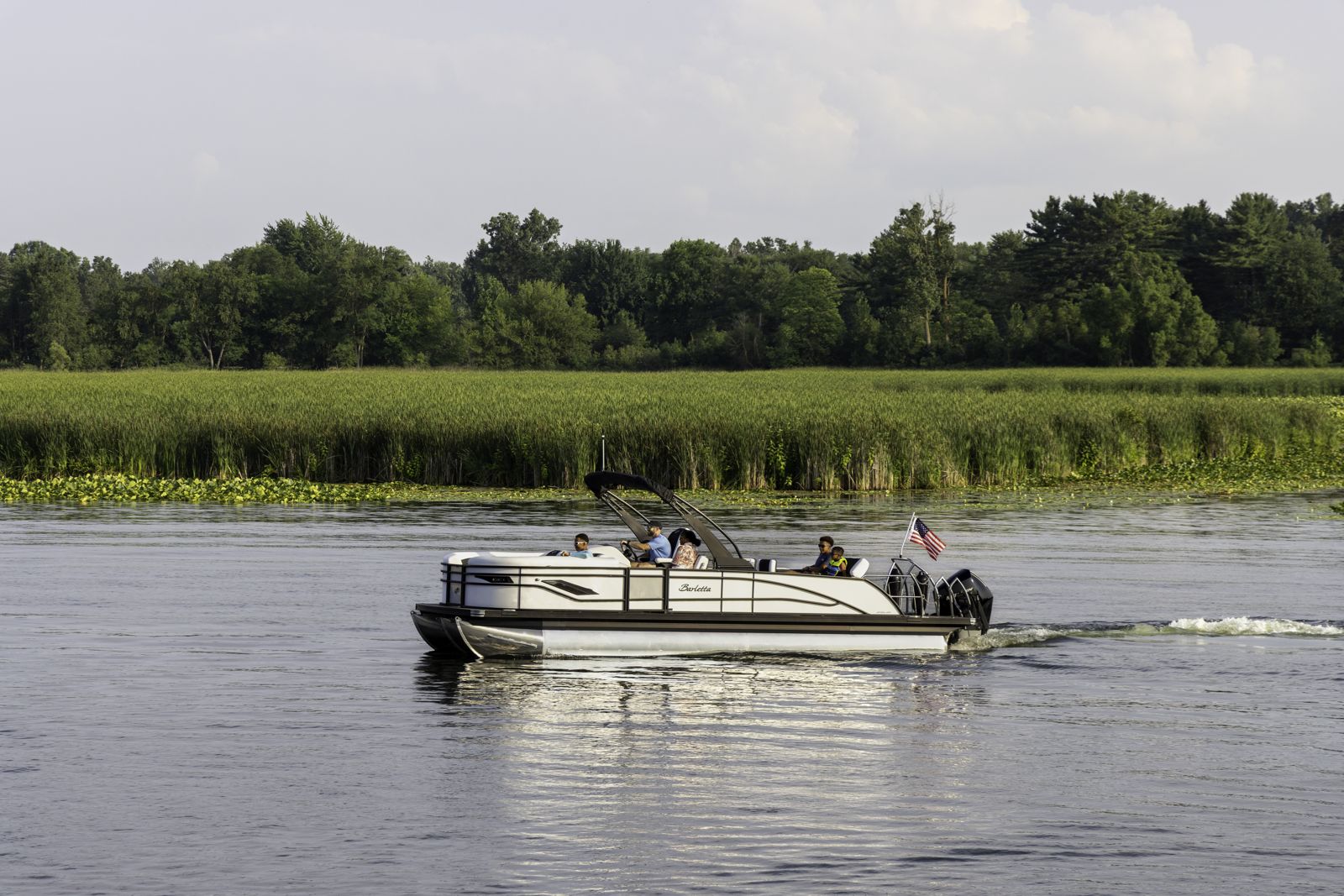 Barletta pontoon cruising past the reeds